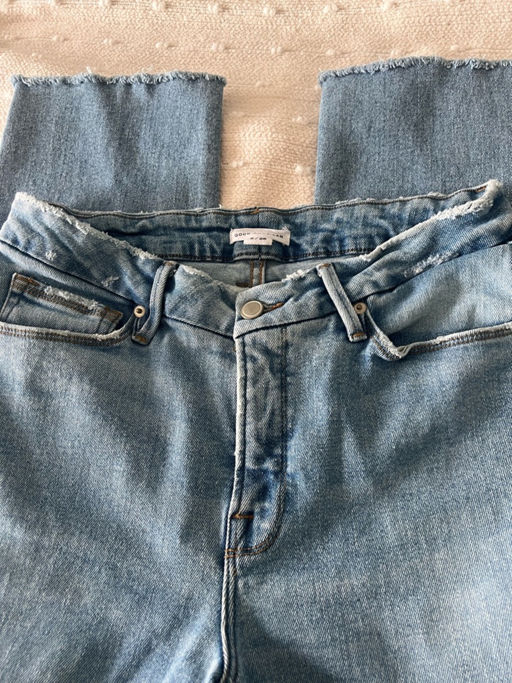 Good American Light Wash Straight Leg Jeans with Frayed Hem